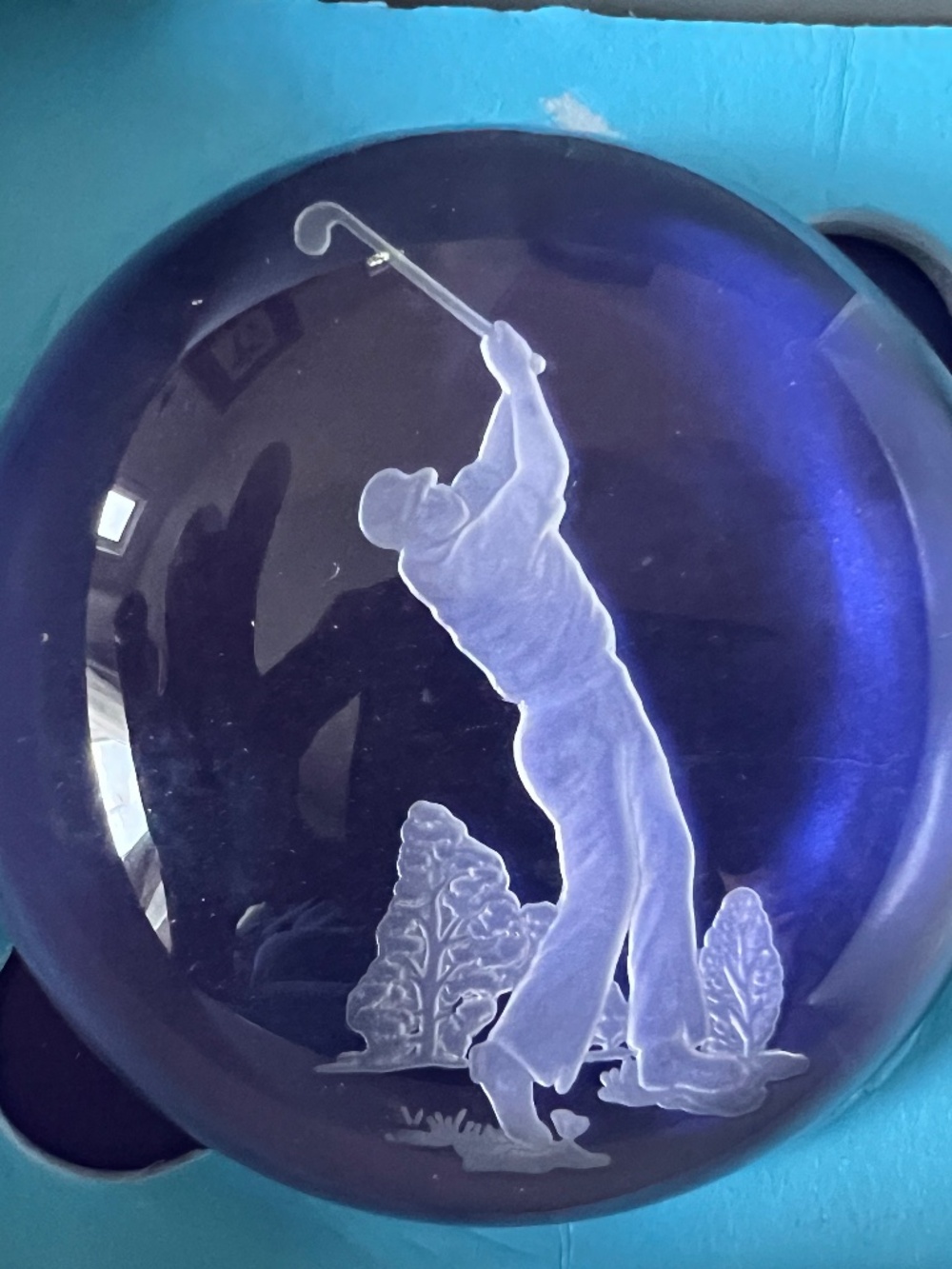 Crystal dome paperweight features Etched 3D Golfer swinging a club